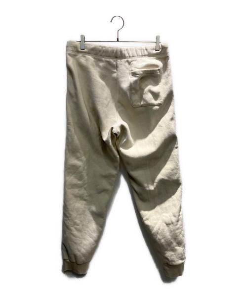 CarHartt（カーハート）CarHartt (カーハート) アメリカンスクリプトジョギングスウェットパンツ アイボリー サイズ:Mの古着・服飾アイテム