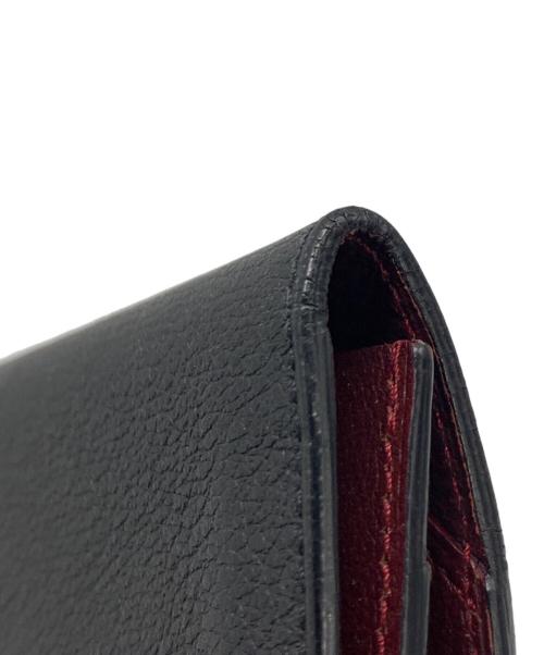 Cartier（カルティエ）Cartier (カルティエ) 二つ折り長財布 ブラック×レッドの古着・服飾アイテム