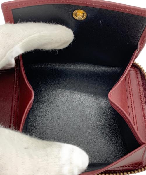 COMME des GARCONS（コムデギャルソン）COMME des GARCONS (コムデギャルソン) 2つ折り財布 レッドの古着・服飾アイテム