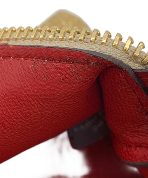 ANYA HINDMARCH（アニヤ・ハインドマーチ）ANYA HINDMARCH (アニヤ・ハインドマーチ) ハンドポーチ ゴールドの古着・服飾アイテム