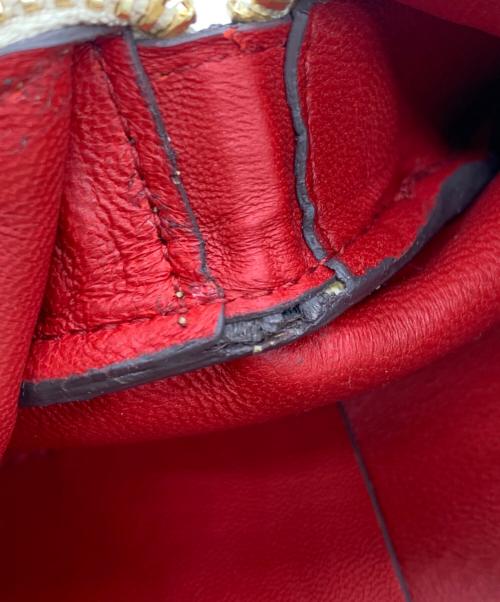 ANYA HINDMARCH（アニヤ・ハインドマーチ）ANYA HINDMARCH (アニヤ・ハインドマーチ) ハンドポーチ ゴールドの古着・服飾アイテム