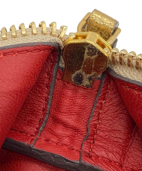 ANYA HINDMARCH（アニヤ・ハインドマーチ）ANYA HINDMARCH (アニヤ・ハインドマーチ) ハンドポーチ ゴールドの古着・服飾アイテム