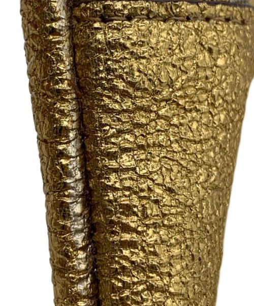 ANYA HINDMARCH（アニヤ・ハインドマーチ）ANYA HINDMARCH (アニヤ・ハインドマーチ) ハンドポーチ ゴールドの古着・服飾アイテム