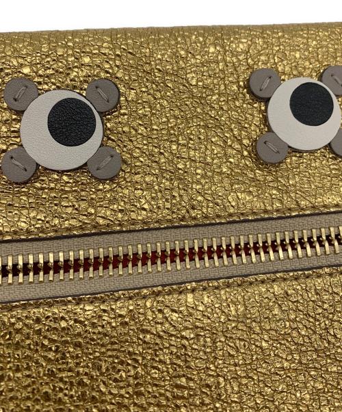 ANYA HINDMARCH（アニヤ・ハインドマーチ）ANYA HINDMARCH (アニヤ・ハインドマーチ) ハンドポーチ ゴールドの古着・服飾アイテム