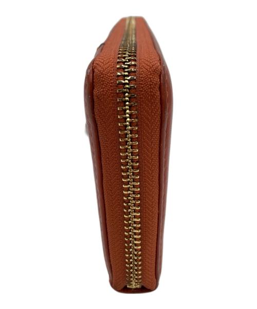 COACH（コーチ）COACH (コーチ) ラウンドファスナー長財布 オレンジの古着・服飾アイテム