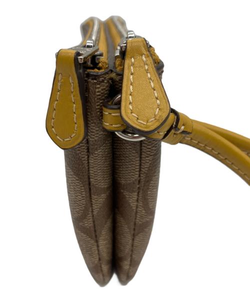 COACH（コーチ）COACH (コーチ) ポーチ ベージュ×イエローの古着・服飾アイテム