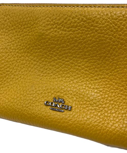 COACH（コーチ）COACH (コーチ) PEANUTS (ピーナッツ) ポーチ イエローの古着・服飾アイテム