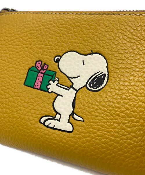 COACH（コーチ）COACH (コーチ) PEANUTS (ピーナッツ) ポーチ イエローの古着・服飾アイテム