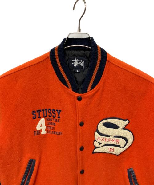 stussy（ステューシー）stussy (ステューシー) スタジャン オレンジ×ネイビー サイズ:Sの古着・服飾アイテム