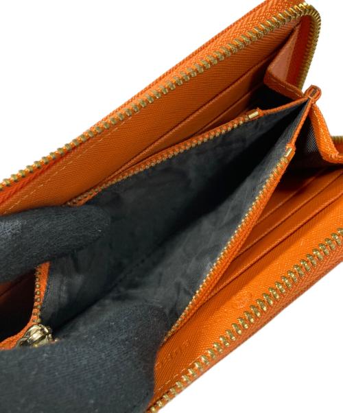 TORY BURCH（トリーバーチ）TORY BURCH (トリーバーチ) ラウンドファスナー財布 オレンジの古着・服飾アイテム