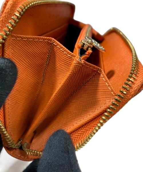 TORY BURCH（トリーバーチ）TORY BURCH (トリーバーチ) ラウンドファスナー財布 オレンジの古着・服飾アイテム