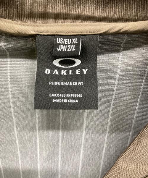 OAKLEY（オークリー）OAKLEY (オークリー) ゴルフウェア(トップス) ホワイト×ブラウン サイズ:2XLの古着・服飾アイテム