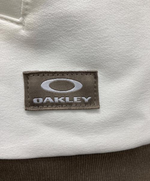 OAKLEY（オークリー）OAKLEY (オークリー) ゴルフウェア(トップス) ホワイト×ブラウン サイズ:2XLの古着・服飾アイテム
