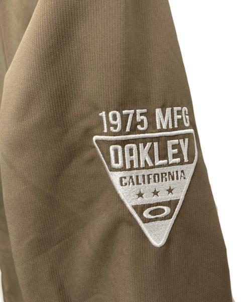 OAKLEY（オークリー）OAKLEY (オークリー) ゴルフウェア(トップス) ホワイト×ブラウン サイズ:2XLの古着・服飾アイテム