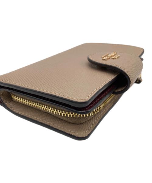 COACH（コーチ）COACH (コーチ) 2つ折り財布 ベージュの古着・服飾アイテム