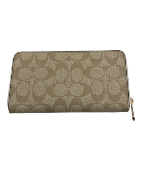 COACH（コーチ）COACH (コーチ) ラウンドファスナー財布 ベージュ×ホワイトの古着・服飾アイテム