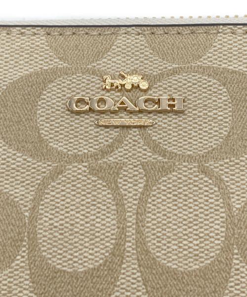 COACH（コーチ）COACH (コーチ) ラウンドファスナー財布 ベージュ×ホワイトの古着・服飾アイテム