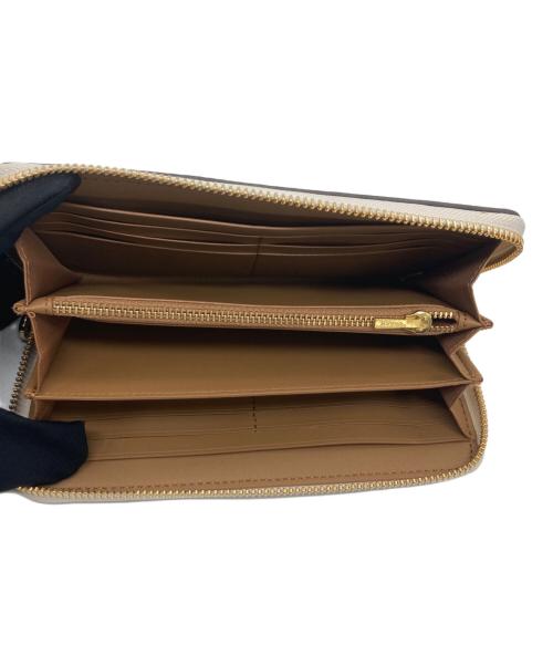 COACH（コーチ）COACH (コーチ) ラウンドファスナー財布 ベージュ×ホワイトの古着・服飾アイテム