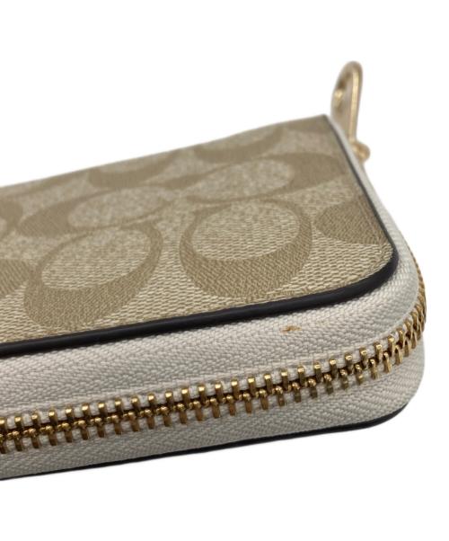 COACH（コーチ）COACH (コーチ) ラウンドファスナー財布 ベージュ×ホワイトの古着・服飾アイテム