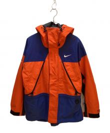 NIKE（ナイキ）の古着「スキーウェア(ジャケット)」｜オレンジ×ブルー