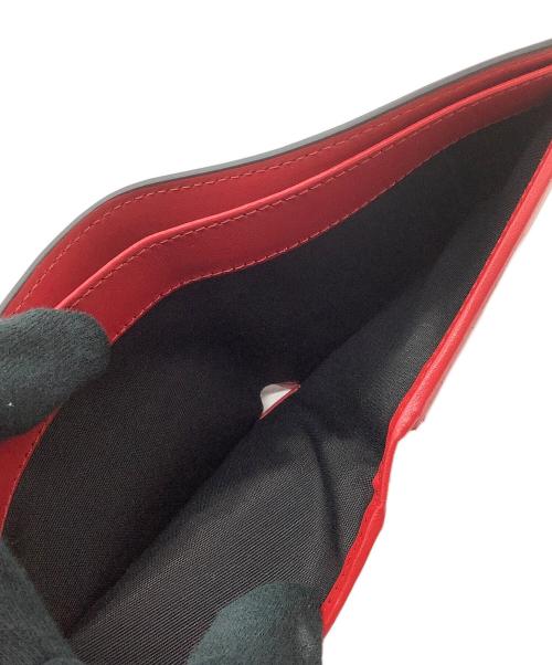 VERSACE（ヴェルサーチェ）VERSACE (ヴェルサーチェ) 2つ折り財布 ブラック×レッドの古着・服飾アイテム