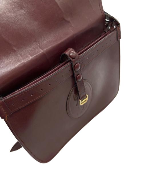 must de cartier（マストドゥカルティエ）must de cartier (マストドゥカルティエ) フラップショルダーバッグ ボルドーの古着・服飾アイテム