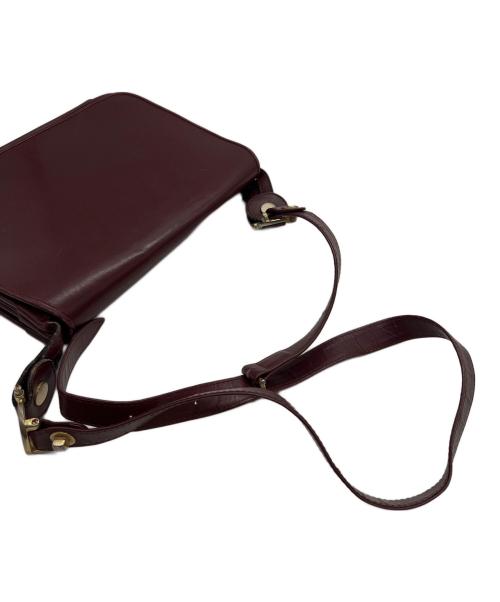 must de cartier（マストドゥカルティエ）must de cartier (マストドゥカルティエ) フラップショルダーバッグ ボルドーの古着・服飾アイテム