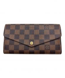 LOUIS VUITTON（ルイ ヴィトン）の古着「2つ折り財布」｜ブラウン