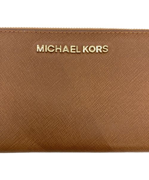 MICHAEL KORS（マイケル・コース）MICHAEL KORS (マイケルコース) MICHAEL KORS ラウンドファスナー財布 ブラウンの古着・服飾アイテム