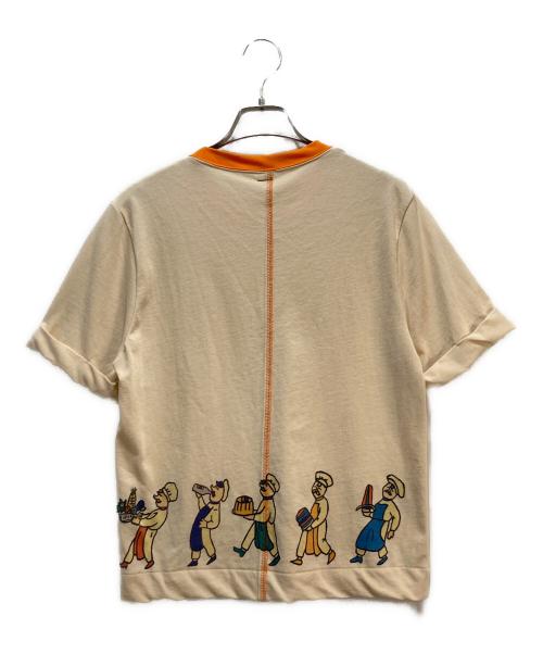 SHINYA KOZUKA（シンヤコズカ）SHINYA KOZUKA (シンヤコズカ) SHINYA KOZUKA（シンヤコズカ）プリントTシャツ アイボリー×オレンジ サイズ:Mの古着・服飾アイテム
