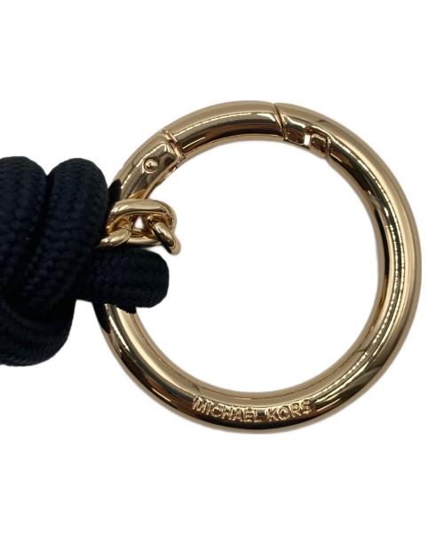 MICHAEL KORS（マイケル・コース）MICHAEL KORS (マイケル・コース) ゴールドストーン＆コードバッグチャーム ゴールド×ブラック 未使用品の古着・服飾アイテム