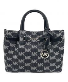 MICHAEL KORS（マイケル・コース）の古着「CARSON センタージップ サッチェル スモール MKシグネチャー」｜ブラック×ホワイト