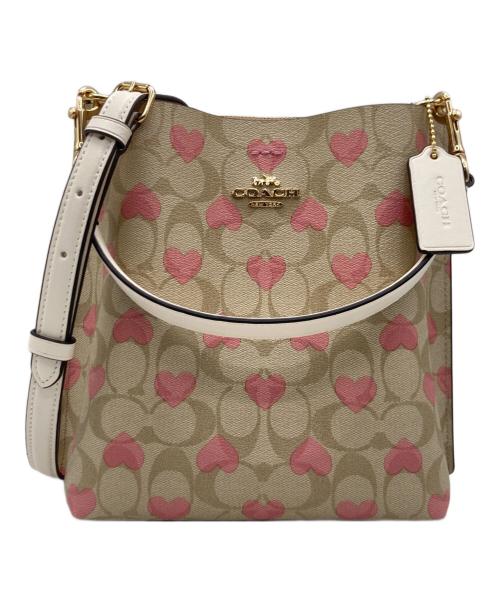 COACH（コーチ）COACH (コーチ) モリーバケットバッグ22 シグネチャー キャンバス ハート プリント ベージュ×ピンクの古着・服飾アイテム