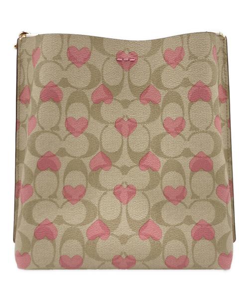 COACH（コーチ）COACH (コーチ) モリーバケットバッグ22 シグネチャー キャンバス ハート プリント ベージュ×ピンクの古着・服飾アイテム