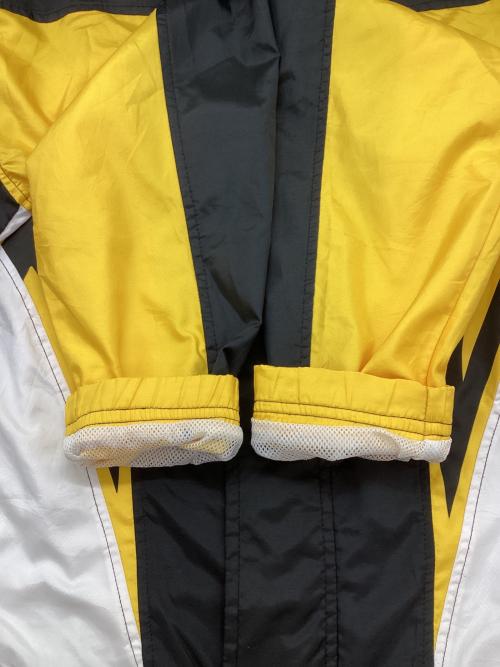 asics（アシックス）asics (アシックス) ナイロンジャケット イエロー×ブラック サイズ:Lの古着・服飾アイテム