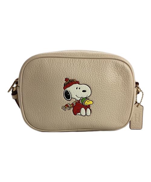 COACH（コーチ）COACH (コーチ) PEANUTS (ピーナッツ) COACH×PEANUTS　ミニ ジェイミー カメラ バッグ・スヌーピー カドル モチーフ アイボリーの古着・服飾アイテム