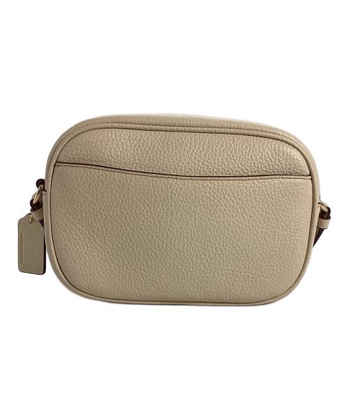 COACH（コーチ）COACH (コーチ) PEANUTS (ピーナッツ) COACH×PEANUTS　ミニ ジェイミー カメラ バッグ・スヌーピー カドル モチーフ アイボリーの古着・服飾アイテム