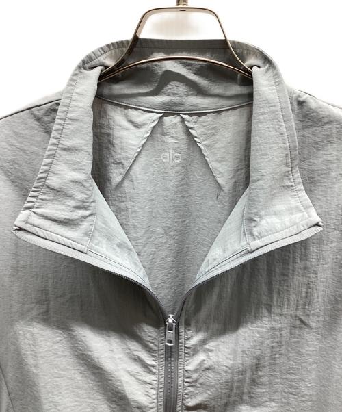 alo yoga（アローヨガ）alo yoga (アローヨガ) Takeaway Track Full Zip Jacket  テイクアウェイ トラック フルジップ ジャケット ライトグレー サイズ:Mの古着・服飾アイテム