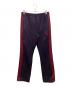 Needles（ニードルズ）の古着「ナロートラックパンツ」｜パープル