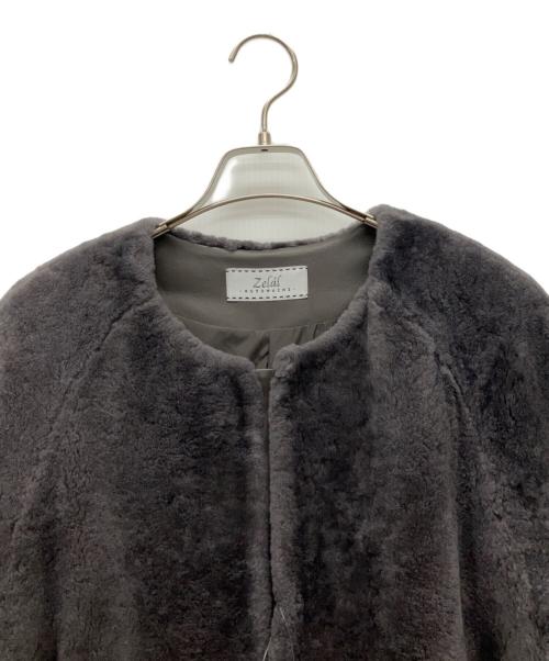 MOTOMACHI Zelal（モトマチゼラール）MOTOMACHI Zelal (モトマチゼラール) ノーカラームートンコート グレー サイズ:11AR 未使用品の古着・服飾アイテム