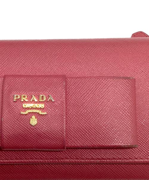 PRADA（プラダ）PRADA (プラダ) カードケース付リボン二つ折り長財布 SAFFIANO FIOCCOの古着・服飾アイテム