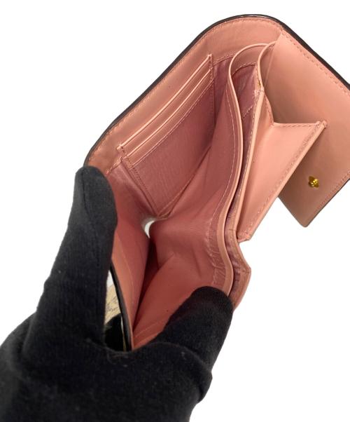 MCM（エムシーエム）MCM (エムシーエム) 3つ折り財布 ベージュの古着・服飾アイテム
