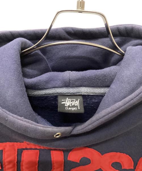 stussy（ステューシー）stussy (ステューシー) Stussy World Wide プルオーバーパーカー ネイビー サイズ:Largeの古着・服飾アイテム