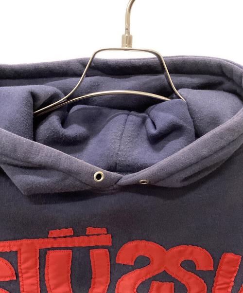 stussy（ステューシー）stussy (ステューシー) Stussy World Wide プルオーバーパーカー ネイビー サイズ:Largeの古着・服飾アイテム