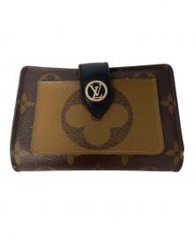 LOUIS VUITTON（ルイ ヴィトン）の古着「2つ折り財布」｜ブラウン