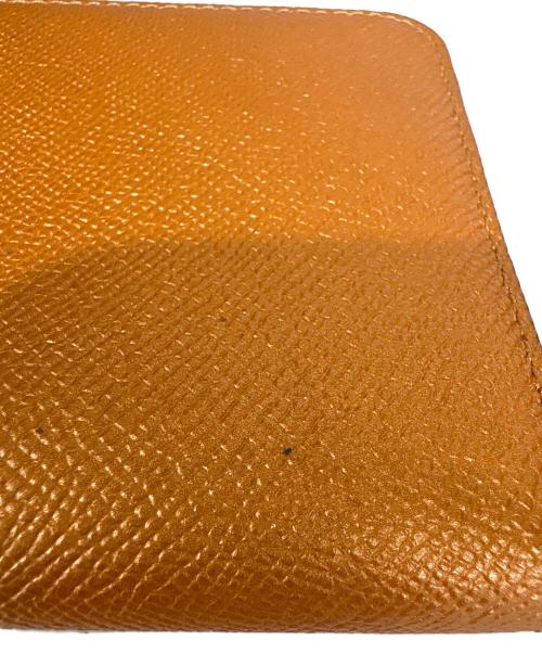 COACH（コーチ）COACH (コーチ) ラウンドファスナー長財布 オレンジの古着・服飾アイテム