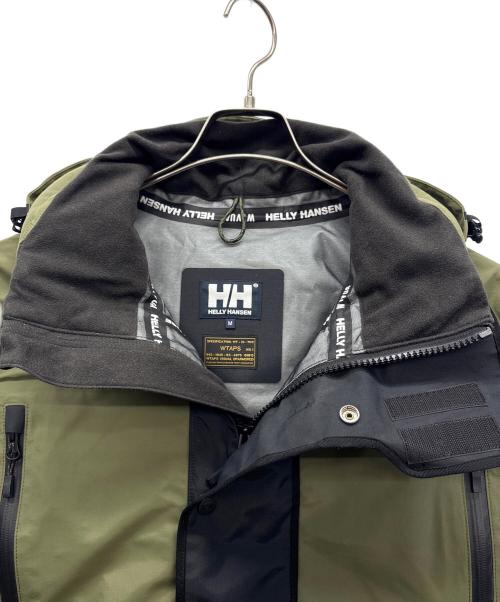 WTAPS（ダブルタップス）WTAPS (ダブルタップス) HELLY HANSEN (ヘリーハンセン) マウンテンパーカー オリーブ×ブラック サイズ:Ｍの古着・服飾アイテム