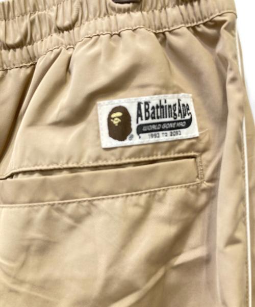 A BATHING APE（ア ベイシング エイプ）A BATHING APE (ア ベイシング エイプ) トラックパンツ ベージュ サイズ:XLの古着・服飾アイテム