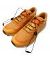 SALOMON（サロモン）の古着「ランニングシューズ」｜オレンジ