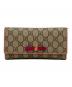 GUCCI（グッチ）の古着「長財布」｜ブラウン×オレンジ
